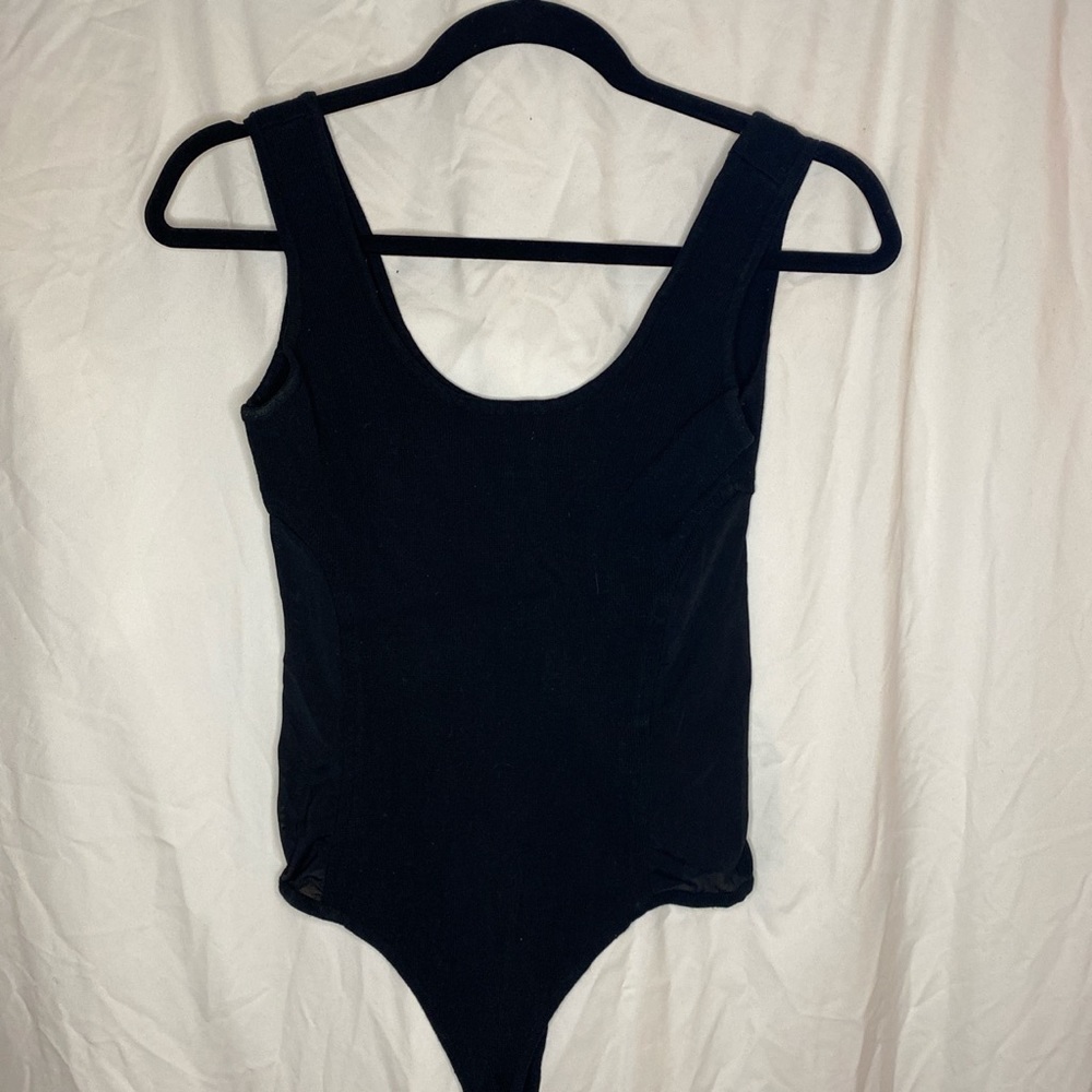 Black bodysuit with mesh.